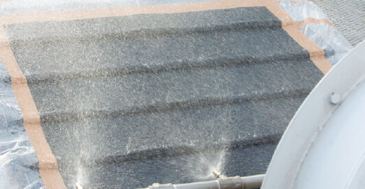 Water spray test conducted on a panel to examine waterproof performance and surface resistance